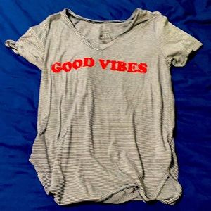 It is a grey and red shirt size L